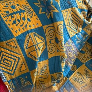100% muslin cotton Geometric Patterned Teal and Mustard blanket (both $50)
